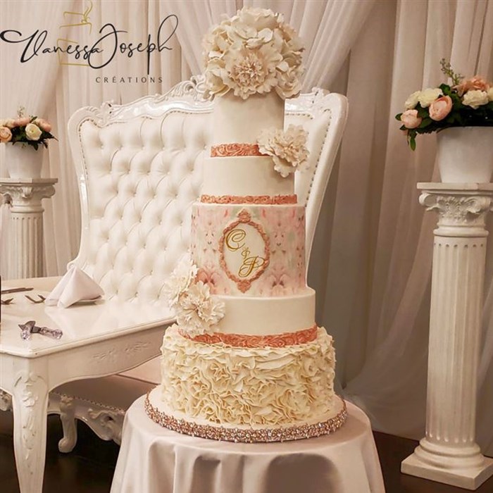 romantic white and rose gold wedding cake with white flowers