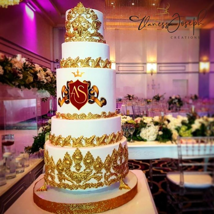 Monogrammed king and queen crown style, white and gold wedding cake 