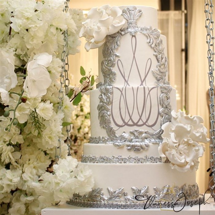 Baroque white and silver wedding cake with white flowers