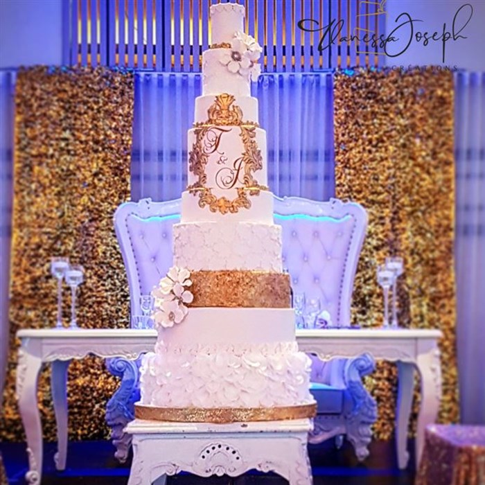Spectacular baroque white and gold wedding cake