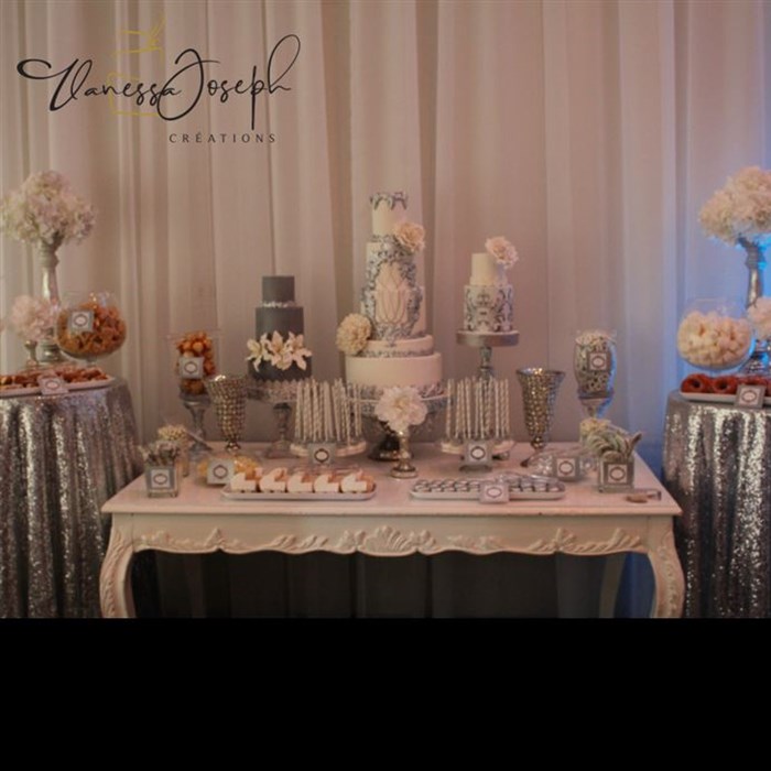 Extravagant baroque white and silver dessert table