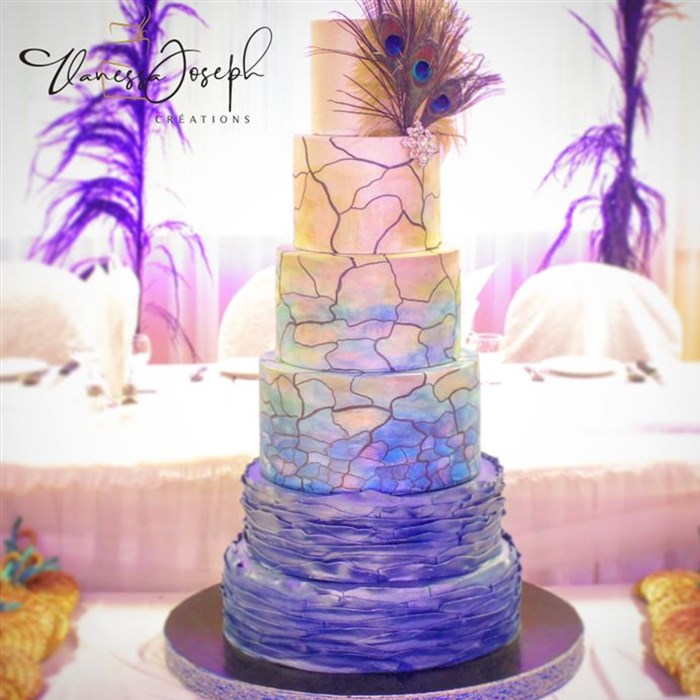 Peacock and stained glass style white, marine blue, turquoise, green and yellow wedding cake 