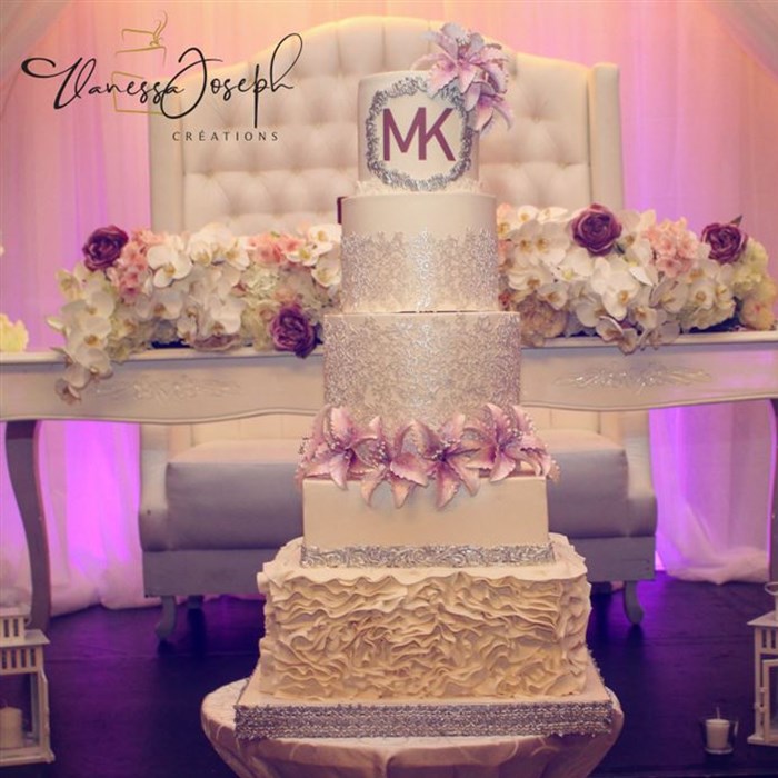 white and silver wedding cake with lilas flowers 